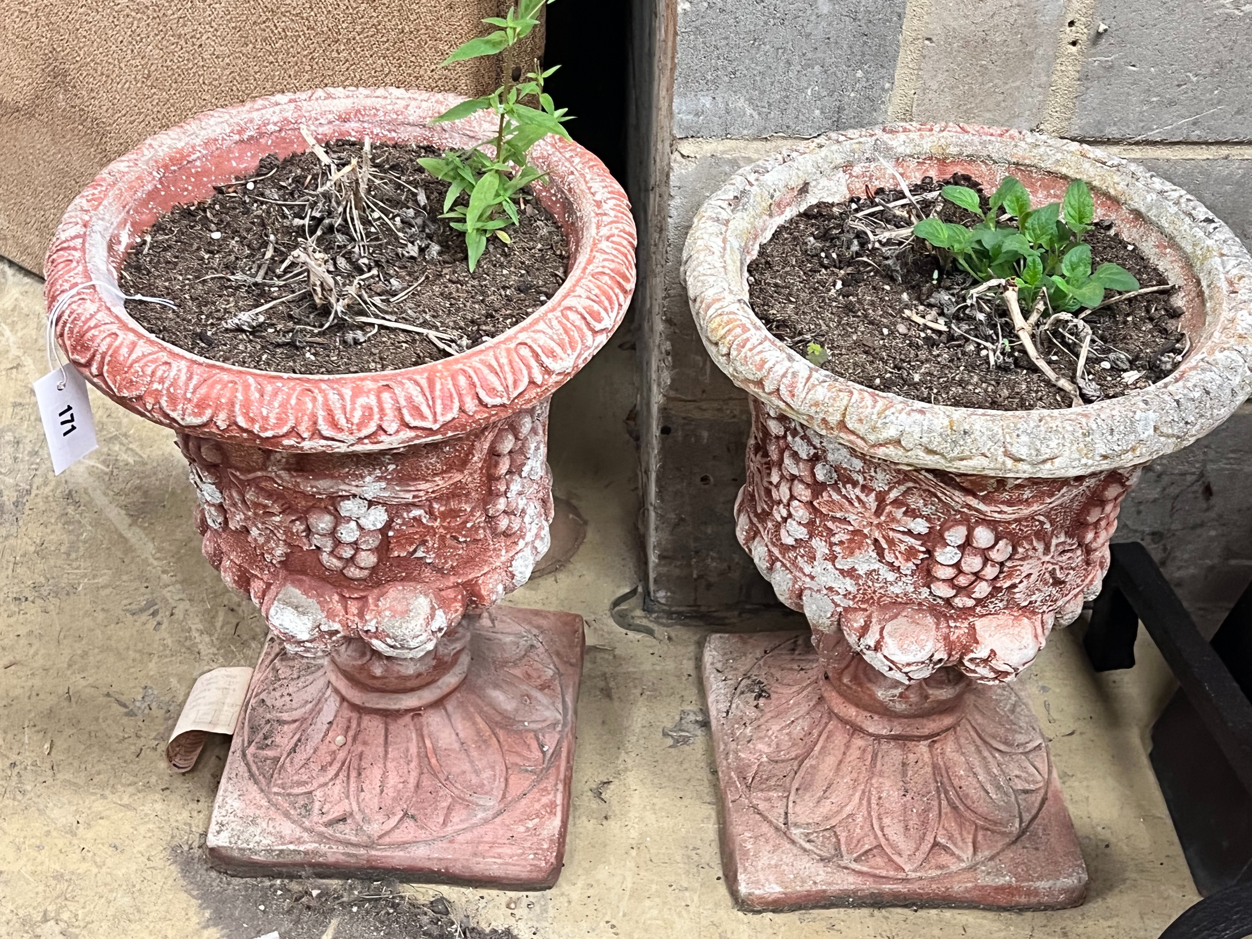 A pair of painted reconstituted stone campana garden urns, diameter 36cm height 49cm